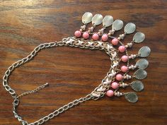 This is a OOAK Unmarked Necklace. It is a Choker Style with an Extension and Measures Approximately 20 inches from End to End. It has a Light Pink Criss Cross Leather on the Top of the Bead Row and the Beads are a Crackled Peach with small Beads below and Hanging Goldtone Pieces. The Hanging Part is about 2 1/2 inches including the Leather Section. It has a Claw Clasp and it is in Very Good Vintage Condition and Ready to Wear or give as a Gift. I just Love it and you will to!, Pink Beaded Metal Necklace, Pink Metal Necklace With Beaded Chain, Pink Beaded Chain Necklace As Fashion Accessory, Pink Necklace With Colorful Beads As Fashion Accessory, Pink Necklace With Colorful Beads, Necklace Leather, Small Beads, Choker Style, End It