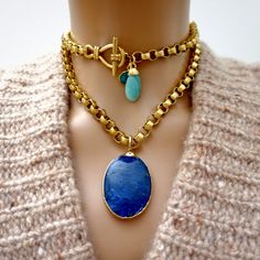 Handcrafted necklace, large vintage Lapis Lazuli pendant gold electroplated, a stunning vintage chain, a gorgeous vintage toggle clasp, a small green Agate gemstone tear drop charm and a larger vintage Amazonite gemstone pendant. Wear it long or doubled with jeans and a t-shirt for a super chic and stylish look. Lapis Lazuli a stone of wisdom, intuition, and truth, the Lapis Lazuli meaning is known as a powerful crystal for anyone seeking to deepen their connection to self. Lapis lazuli is a hig Large Gemstone Pendant, Vintage Teardrop Natural Stones Jewelry, Elegant Gold Toggle Necklace With Gemstone, Elegant Gold Toggle Necklace With Natural Stones, Elegant Toggle Necklace With Natural Stones For Gift, Vintage Gemstone Teardrop Pendant, Handmade Gold Necklaces For Accessorizing, Gold Double Strand Jewelry With Natural Stones, Handmade Gold Necklace For Accessorizing