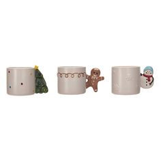 three mugs with christmas decorations on them, one has a snowman and the other has a gingerbread man