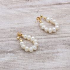 "These beautiful earrings are handcrafted with freshwater cultured white pearls. They have a high lustre, making them perfect for any occasion. The simple design is perfect for everyday wear, and the delicate pearls add a touch of elegance. Whether you're dressing up for a special occasion or just accenting your everyday look, these earrings are a must-have. + Genuine freshwater cultured baroque pearls. High luster and handpicked. Each pearl is unique. Directly sourced from origin of production. Floating Pearl Necklace, Rice Pearls, Long Earring, White Rice, Jewelry Earrings Hoops, Gold Hoop, Baroque Pearls, Gold Hoop Earrings, White Pearl