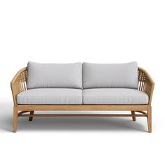 an image of a couch that is made out of wood and grey fabric with white cushions