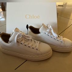 Never Worn Still In Packaging White Chloe Lauren Sneakers. Size 39 Chloe Lauren Sneakers Outfit, Chic Sneakers With Textured Sole And Round Toe, Chic Sneakers With Rubber Sole And Round Toe, Chic Low-top Sneakers With Rubber Sole, Chic Sneakers With Leather Sole And Round Toe, Chic Leather Sneakers With Laces, Chic Lace-up Sneakers With Contrast Sole, Chic Sneakers With Leather Sole, Chic White Flat-heeled Sneakers