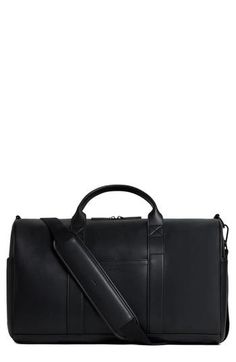 a black leather duffel bag on a white background