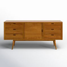 a wooden dresser with three drawers and two legs