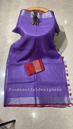 Linen sarees are always in demand.This handwoven purple linen saree give you a unique style.Linen sarees are breathable,light weight and easy to drape. Fabric: Linen by linen  Thread count:100 count Saree Color:purple Blouse piece:Red/ Running Occasion: Casual/Formal Saree length:5.50 mtr Blouse:80 cm Custom Stitching: Available upon request Saree Embroidery: Available upon request Blouse Stitching: Available upon request Shipping: 7 to 10 business days Note: Color may very slightly due to photo Purple Slub Silk Handloom Dupatta, Handloom Slub Silk Purple Dupatta, Purple Handloom Slub Silk Dupatta, Linen Saree With Pallu, Festive Linen Saree With Zari Weaving, Festive Linen Saree With Pallu Detail, Linen Dupatta For Festivals, Festive Handloom Linen Saree, Festive Linen Handloom Saree