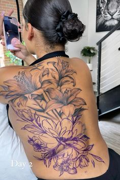 a woman with a tattoo on her back