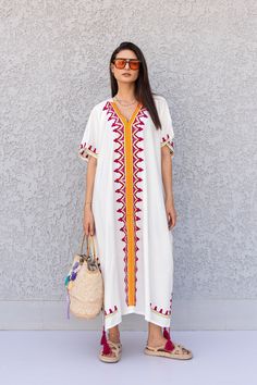 "This beautiful free size Kaftan has a unique presence to it. It's colorful and most importantly comfortable wear, light and soft and can be used on many occasions - home gatherings, dinners, or just in your home to feel comfortable. Fabric : 80% Egyptian Cotton and 20% Polyester Measurements : Free size. Fits up to 4XL. Also there is a belt that can be used to tighten the dress around the hips. Bust size : 67 inches Length : 57 inches **Note : The kaftan in the video is a different color of the White V-neck Kaftan For Spring, White V-neck Dress With Geometric Embroidery, White V-neck Embroidered Dress For Festival, White Resham Embroidery Dress For Festival, White V-neck Dress With Resham Embroidery, Traditional White V-neck Maxi Dress, White Bohemian Dress With Resham Embroidery, White Folk Style Kaftan With Floral Embroidery, Bohemian Kaftan With Chikankari Embroidery