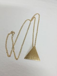 I've designed a Stevie Nicks inspired triangle pyramid pendant necklace like the one she wore in the Rumours era. It's one inch in diameter and I've made from solid sterling silver and then used a 24K gold plating so it has the look of gold, without nearly the same expense! The plating will last if you take care of the necklace, so be mindful not to sleep in it or wear it in the shower or swimming. The chain is gold-filled and will come with a lobster claw for secure attachment. You can choose y Pyramid Necklace, Stevie Nicks Style, Secure Attachment, Triangle Necklace, Crescent Moon Necklace, Stevie Nicks, One Inch, Curb Chain, Pyramid