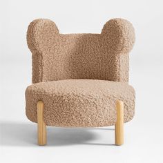 a chair made out of sheep's wool with wooden legs