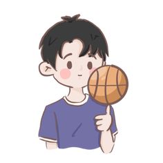 a boy holding a basketball in his hand