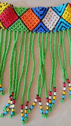 Zulu Beaded Choker necklace, African Choker necklace, Beaded Necklace for women, Tassel necklace, Fringe Necklace, Christmas gift This fringe necklace is elegantly crafted using fine Masai beads. It is attractive to wear and very light in weight. It has an adjustable clasp to fit all neck sizes. Main color - Green. *Available in different colors kindly select the color option above. Wholesale available at a fair price,please contact me. For any clarification,please send me a convo or an e-mail. Traditional Green Beaded Necklaces With Dangling Beads, Traditional Green Beaded Necklace With Dangling Beads, Adjustable Beaded Necklaces With Fringe And Round Beads, Green Dangling Beads For Festival, Adjustable Green Beaded Tassel Necklace, Green Beads For Festivals, Traditional Beaded Fringe Necklace As Gift, Green Beaded Necklace With Large Beads For Festivals, Festival Round Beaded Fringe