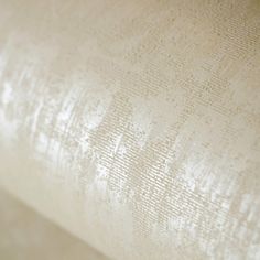 a close up view of the textured fabric on a bed sheet that has been made into a pillow