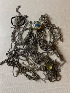 This is a 1/2 pound lot of broken and not, vintage and newer craft jewelry. The majority of these are wearable or for craft Silver tones There are necklaces, earrings, bracelets, key rings, broken pieces etc etc. Both vintage and modern. Perfect for your slow stitches or scrapbooking projects. Or other works of art This is NOT a mystery bag or box, so there will be no surprises You get everything in the picture. So study the pictures carefully !! Various materials such as plastic, metal, beads, Victorian Style Metal Jewelry With Jewels, Ornate Metal Jewelry Collectible, Collectible Round Costume Jewelry, Vintage Metal Jewelry For Collectors, Nickel-free Victorian Metal Jewelry, Metal Charms Jewelry For Accessorizing, Victorian Vintage Charm Metal Jewelry, Collectible Jewelry With Jewels, Costume Jewelry For Accessorizing