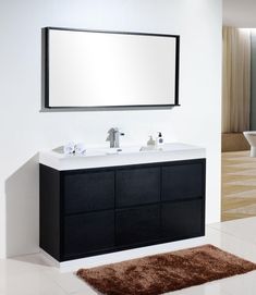 a bathroom with two sinks and a large mirror above the sink is in front of a bathtub