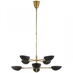 a brass chandelier with five black shades on the bottom and one light fixture above it