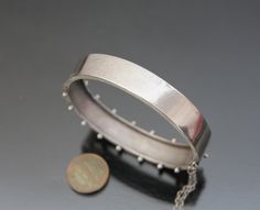 "Antique - Victorian Aesthetic hinged bangle bracelet. Late 19th century, Germany. MADE OF: silver 800. CONDITION: As seen, excellent antique condition. With no loses or dents. Clasp works well. MEASUREMENTS: Inner circumference approx. 6 3/4\" (17,2cm). Wide: 5/8\" or 15mm. Weight: 16,1g. * * * All our items are packed in gift boxes, easy to check of content and re-pack. If you wish something special, please let us know. * * * LAYAWAYS: All items can be put on layaway, max 4 months. First payme Victorian Sterling Silver Engraved Bracelet, Antique Hallmarked Round Bangle, Antique Round Hallmarked Bangle, Victorian Adjustable Engraved Bangle, Victorian Adjustable Engraved Cuff Bracelet, Victorian Hinged Round Bangle, Antique Hinged Cuff Bracelet, Victorian Hinged Cuff Bangle Bracelet, Victorian Round Hinged Bangle