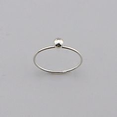 Sterling Modernist Ball Ring, Minimalist Sterling Ring, Silver charm Ball Ring Jewelry CODE: PLSRG92 Material: 925 Sterling Silver Finishing: silver Weight: 0.72 gram Ring size: 6,7,8 available Price per piece Minimalist Sterling Silver Ball Ring for Everyday Elegance" its made by hand This understated silver ring features a smooth, spherical design--a true embodiment of simplicity and timeless style. Crafted from 925 sterling silver, it's perfect for those who appreciate effortless elegance.  H Minimalist Sterling Silver Promise Ring, Silver Minimalist Stackable Jewelry, Minimalist Silver Stackable Open Rings, Adjustable Silver Stackable Minimalist Rings, Adjustable Minimalist Silver Stackable Rings, Minimalist Adjustable Silver Stackable Rings, Minimalist Stackable Open Rings Stamped 925, Nickel-free Silver Minimalist Stackable Rings, Minimalist Nickel Free Round Band Jewelry