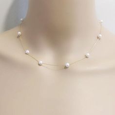 Item No: NK584Item:sterling silver pearl necklacePearl shape:round shapePearl size:5-6mmPearl color: whitePearl skin: with little flawsPearl luster: goodPearl quality: AAthe space between two pearl: 3.5cmChain length: 16inch,18inch,20inch,22inch,24inch,26inch,27.5inchChain: sterling silver with white gold plated, or yellow gold platedPacking: beautiful giftbox, ready for gift givingPlease contact Lisha if any more questions. Spaced Out Pearl Necklace, 5 Pearl Necklace, Gold Pearl Jewelry Necklace Classic, Bride With Pearl Necklace, Pearl Necklace Prom, Pearl Bridal Necklace, Classic White Chain Necklace With Pearl Charm, Classic White Pearl Drop Chain Necklace, Delicate White Pearl Drop Chain Necklace