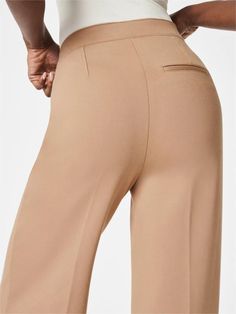 One of Oprah's Favorite Wide Leg Pant Designed with premium stretch fabrication, high-waist coverage and hidden core shaping technology, these pull-on wide-leg pants put a new spin on retro silhouettes. Made from smooth premium two-tone fabric that hides cellulite No Zipper Our wide-leg pants feature a pull-on design and gold decorative buttons that move and stretch with your body. 4-way stretch Designed with comfortable, 4-way stretch fabric for amazing stretch and recovery. Hidden core shaping Pull-on Style Wide-leg Elastane Bottoms, Pull-on Style High-waisted Wide Leg Pants For Business Casual, Wide Leg Business Casual Pull-on Pants, Stretch Wide-leg Workwear Bottoms, Stretch Wide Leg Workwear Bottoms, Stretch Wide Leg Bottoms For Workwear, Elastane Wide Leg Pants For Business Casual, Wide Leg Elastane Pants For Business Casual, Wide-leg Pull-on Pants For Work