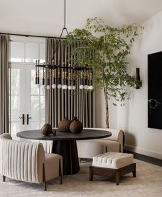 an elegant dining room with black and white decor