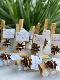 small wooden pegs with place cards attached to them