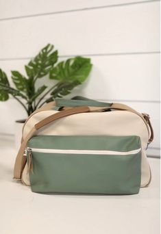 Jadelynn Brooke Remi Duffle Bag-Sage-Travel Bags-Jadelynn Brooke-Shop with Bloom West Boutique, Women's Fashion Boutique, Located in Houma, Louisiana Green Double Handle Travel Bag For On-the-go, Chic Travel Duffle Bag With Removable Pouch, Chic Duffle Bag With Removable Pouch For Daily Use, Modern Crossbody Travel Bag For On-the-go, Trendy Beige Travel Bag, Trendy Travel Bag With Detachable Strap For Everyday, Trendy Travel Bag With Detachable Strap, Versatile Weekender Tote Bag With Detachable Strap, Versatile Weekender Bag With Detachable Strap