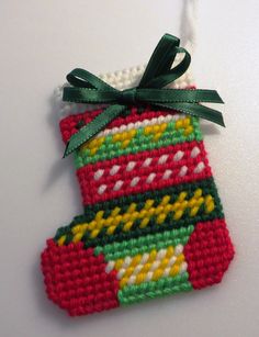 a christmas stocking ornament hanging from a string