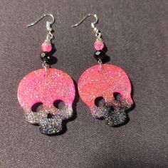 Glowing Skull Earrings 💀💀 Glow in the dark/ blacklight glow Get these or customize your very own pair Black Skull Print Earrings As Gift, Black Skull-shaped Earrings With Skull Print, Pink Skull Jewelry For Halloween, Black Skull Earrings For Parties, Handmade Black Skull Earrings, Black Glow In The Dark Jewelry For Parties, Black Glow In The Dark Party Jewelry, Handmade Black Rave Jewelry, Black Handmade Rave Jewelry