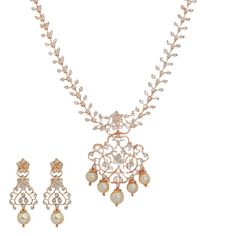 The spectacular assortment of diamonds and pearls used to create this rose gold necklace and earring set adds a shimmering effect that is hard to ignore. Pairing this stunning 18k rose gold diamond necklace and earring set with formal and traditional gowns is a decision you won't regret.Features• 18k rose gold• Diamonds• PearlsAs a leading gold Indian jewelry store in the USA, we are proud to offer a wide selection of beautiful, handcrafted jewelry, including this gleaming 18k rose gold and diam Dazzling Rose Gold Diamond Necklace With 17 Jewels, Exquisite Rose Gold Diamond Necklaces, Dazzling Rose Gold Diamond Necklace, Fine Jewelry Bridal Necklace In Rose Gold And Diamond, Fine Jewelry Bridal Necklace In Rose Gold With Diamonds, Fine Jewelry Rose Gold Diamond Bridal Necklace, Rose Gold Diamond Bridal Necklace, Wedding Rose Cut Diamond Necklace In Rose Gold, Elegant Rose Gold Jewelry Sets With Diamond Accents