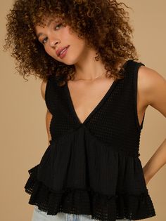 This mixed gauze material babydoll top, offers a cozy yet stylish addition to your everyday wardrobe. With its airy texture and relaxed silhouette, it's perfect for effortless layering or standalone chic. Textured Tops For Spring Loungewear, Spring Textured Loungewear Tops, Spring Textured Tops For Loungewear, Chic Textured Summer Tops, Breezy Ruffled Tops For Day Out, Textured Casual Tops For Loungewear, Flowy Cotton Top For Layering, Feminine Textured Summer Tops, Textured Feminine Summer Tops