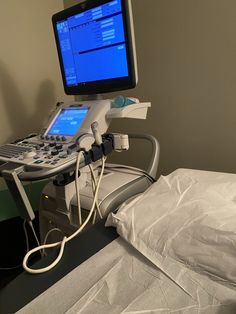 a hospital bed with a monitor and medical equipment