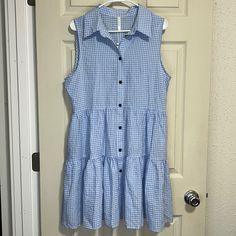 Beachsissi Sleeveless Ruffle Hem Dress Collar Button Down Closure Pockets Plaid Light Blue Size Large Can Also Wear As A Swimsuit Cover Up Nwt- Great Condition- No Flaws Rips Or Stains Smoke Free Home Light Blue Sleeveless Cotton Mini Dress, Sleeveless Sundress With Button Closure, Casual Blue Sleeveless Dress With Ruffles, Beach Sleeveless Dress With Ruffles In Light Blue, Light Blue Sleeveless Dress With Ruffles For Beach, Sleeveless Sundress With Buttons For Day Out, Sleeveless Button Sundress For Day Out, Blue Sleeveless Button Dress For Summer, Sleeveless Buttoned Sundress For Daywear