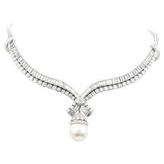 Be the center of attention with this stunning South Sea Pearl Diamond Platinum Dangle Choker Necklace weighing approximately 88.2 grams. Expertly crafted in solid luxurious Platinum, the piece is composed of 154 Dazzling Genuine Large Diamonds Baguette-cut, Channel set, with an approx. weight of 16.50 carats G-H color, VS clarity (48) Genuine Large Diamonds Round-cut, prong-set, with an approx. weight of 8.15 carats (G-H color, VS clarity) The detachable pendant is a magnificent (1) South Sea Pe Vintage Diamond Necklace, Evening Necklace, South Sea Pearl Necklace, Dangle Necklace, Golden South Sea Pearls, Pearl And Diamond Necklace, Jewelry Appraisal, Big Diamond, Dangle Necklaces