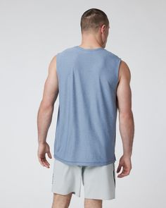 The softest piece of workout gear on the planet gets a new life in this breezy muscle tank. Fully functional and endlessly comfortable, you'll wear this tank all summer long. | Vuori Strato Muscle T-Shirt / Tee | Chambray Heather | XL Vuori makes premium performance apparel inspired by the active Coastal California lifestyle; an integration of fitness, surf, sport, and art. Breaking down the boundaries of traditional activewear, we are a new perspective on performance apparel. Summer Athleisure T-shirt For Gym, Cotton Sleeveless Muscle Tee For Athleisure, Cotton Sleeveless Athleisure Muscle Tee, Relaxed Fit Sleeveless Moisture-wicking Tops, Relaxed Fit Sleeveless Tops With Moisture-wicking, Versatile Tops For Light Exercise, Athleisure Tank T-shirt For Sports, Sporty Moisture-wicking Tank T-shirt, Cotton Muscle Tee For Gym