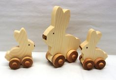 two wooden rabbits sitting next to each other