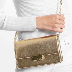 Clutch Metallic 100% Polyurethane Gold-Tone Hardware 8.75"W X 5.5"H X 2.75"D Adjustable Strap: 20.5" Exterior Details: Back Slip Pocket Interior Details: 3 Front Card Slots Lining: 100% Polyester Push-Lock Fastening Imported Style # 35f2g0ec6m Metallic Clutch Bag, Metallic Clutch, Bags Michael Kors, Exterior Details, Michael Kors Bag, Interior Details, Card Slots, Slots, Clutch Bag