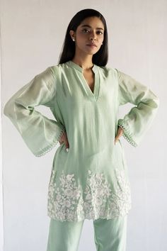 Green straight kurta featuring floral thread embroidery with bell sleeves. Paired with a co-ordinating straight pant. - Aza Fashions Silk Sets With Chikankari Embroidery And Long Sleeves, Spring Long Sleeve Chanderi Kurta, Designer Chikankari Embroidery Blouse For Eid, Silk Palazzo Set With Chikankari Embroidery And Long Sleeves, Silk Long Sleeve Palazzo Set With Chikankari Embroidery, Fitted Long Sleeve Palazzo Set With Embroidered Border, Chanderi Kurta With Embroidered Long Sleeves, Traditional Spring Salwar Kameez With Embroidered Sleeves, Bohemian Straight Kurta With Embroidered Sleeves