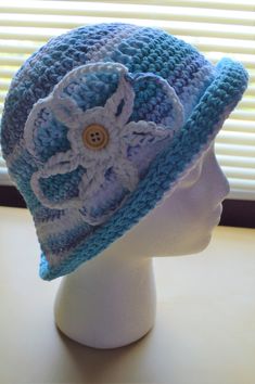 This crochet bucket style hat with interchangeable flower is handmade with 100% cotton yarn. -The hat's color is various shades of blue  -This crochet womens sun hat is made to fit a teen or adult head circumference -Make a fashion statement while keeping your head cool and protected when wearing this handmade cotton sun hat as a stylish crochet beach hat! Affordable Blue Summer Hats, Cheap Blue Summer Hats, Cheap Blue Summer Sun Hat, Cheap Blue Sun Hat For The Beach, Playful Blue Affordable Sun Hat, Cheap Blue Hats For Beach Season, Cheap Blue Vacation Hats, Cheap Blue Crochet Cap, Cheap Blue Cotton Sun Hat