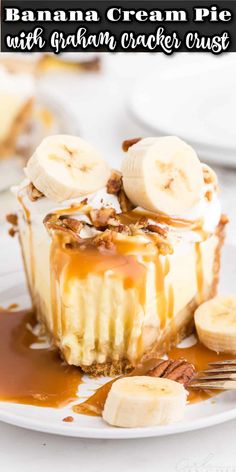 banana cream pie with graham cracker crust on a white plate topped with sliced bananas