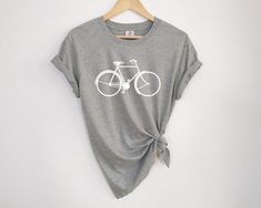 a gray shirt with a white bicycle on it