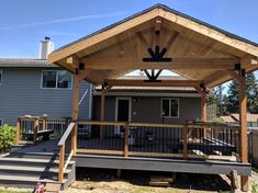 a covered patio with stairs leading up to it