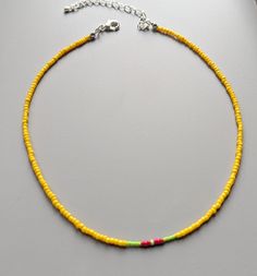 Minimalist handmade beaded yellow necklace Yellow Choker Necklace As A Gift, Yellow Choker Necklace For Gift, Yellow Round Bead Necklaces For Summer, Yellow Necklaces With Colorful Beads For Summer, Tiny Yellow Beads For Summer, Yellow Necklaces For Summer Gifts, Yellow Round Beads Necklace For Summer, Yellow Dainty Jewelry For Summer, Dainty Yellow Jewelry For Summer