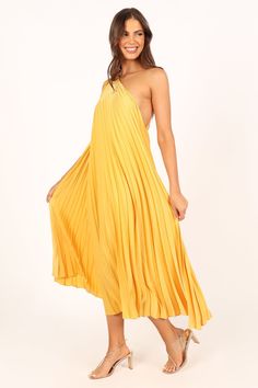 DETAILS   Make a statement in our gorgeous Cali One Shoulder Midi Dress! With its drawstring tie detail and fine pleat feature, this soft feel fabric offers a relaxed fit that is lined for added comfort. Perfect for any occasion, you'll be sure to stand out in this eye-catching golden yellow piece!     midi  length dress    one shoulder design with drawstring tie detail  fine pleat feature  s oft feel fabric   relaxed fit  lined   material - 100% polyester   delicate fabric, may require addi