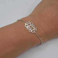 "Silver Monogram bracelet-Sterling silver monogram jewelry-Handmade Christmas gift for Sister This Personalized Monogram Bracelet is one of the most special and personal pieces of jewelry you can own or give as a gift. Please choose 1-3 letters you like and I will create your unique monogram.It can be your initials (usually with the family name in the center),or the initials of those most special to you. HOW TO ORDER: Step 1: Select color and Wrist Size. Step 2: Please write specify the \"initia Elegant Silver Name Bracelet Hypoallergenic, Elegant Hypoallergenic Silver Name Bracelet, Sterling Silver Initials Bracelet For Personalized Gift, Personalized Sterling Silver Initials Bracelet, Adjustable Monogram White Gold Jewelry, Adjustable White Gold Monogram Jewelry, Elegant Silver Bracelets With Initials, Silver Monogram Bracelet With Adjustable Fit, Silver Adjustable Monogram Bracelet