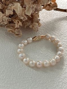 Elevate your style with our exquisite 14K Gold Freshwater Pearl Bracelet, featuring AAA quality large round threaded pearls. Perfect for weddings, this stretch bracelet is a timeless gift for bridesmaids or a special token for friends, symbolizing purity and friendship. With its comfortable fit and radiant luster, it's an ideal accessory for any occasion. Cherish and celebrate moments of love and elegance with this luxurious piece. Details: 14k gold real freshwater round pearls Warranty: I am pr Bracelets Pearls, Real Pearl Bracelet, Bracelet Craft Diy, Bracelet Minimalist, Thread Bracelets, Freshwater Pearl Bracelet, Timeless Gifts, Bracelet Crafts, Swarovski Pearls