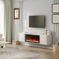 a living room with white furniture and a flat screen tv mounted above the fire place