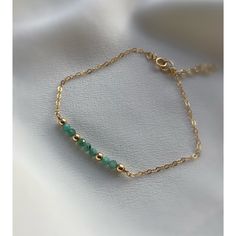 **DESCRIPTION** Delicate gold filled bracelet with micro-faceted emerald beads. Individually selected high quality gemstones make the bracelet truly special and one of a kind. The delicate and minimalist design goes well with both casual and sophisticated looks. Wear it by itself or stacked up with other minimalist bracelets available at the shop. **MATERIALS** - 14kt gold filled chain, 14kt gold filled clasp and chain extender (1 inch) - Emerald beads (approx. 3mm) **PACKAGING** All orders are Faceted Round Bead Bracelets For May Birthstone, Faceted Round Beads Bracelet For May Birthstone, Faceted Beads Bracelets As May Birthstone Gift, Gold Beaded Bracelets With Gemstone Beads, Gold Gemstone Beaded Bracelets In 14k Gold Filled, Faceted Beads Bracelet For May Birthstone Gift, May Birthstone Bracelets With Faceted Beads As Gift, Elegant May Birthstone Beaded Bracelets With Faceted Beads, May Birthstone Faceted Beads Bracelet