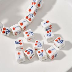 white and red dices with blue writing on them