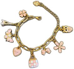 a gold bracelet with charms and flowers on the link, which has an owl, heart, flower, cross, bird, piggy