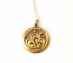 Antique Gold Filled Locket Pendant Necklace. A beautiful Art Nouveau crafted pendant. Featuring floral embossed designs and glass stones. Please note that this locket is missing one half. The frame and paper insert are still intact, so a photo still could be placed inside. This is too beautiful of a locket not to wear despite its missing piece. The gold filled chain was added by me, not vintage. Circa 1910's No markings/hallmarks Measurements: Chain is 18 inches Locket/Pendant is 1.25 inches  Go Half Necklace, Necklace Photo, Art Nouveau Antiques, Locket Pendant Necklace, Vintage Lockets, Photo Locket, Madison Wi, Locket Necklace, Gold Filled Chain